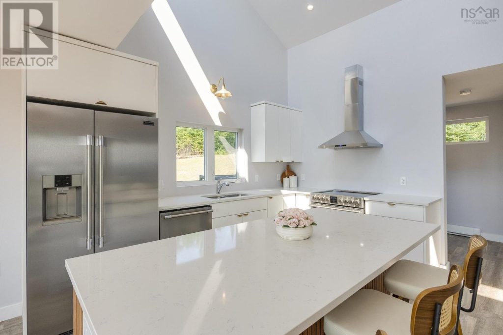 Mid-century modern kitchen in white shaker with champagne bronze hardware